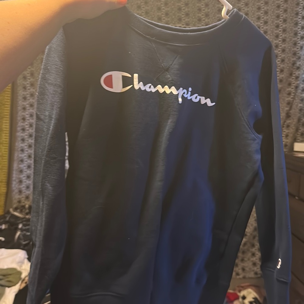 This is a navy blue champion hoodie, size medium